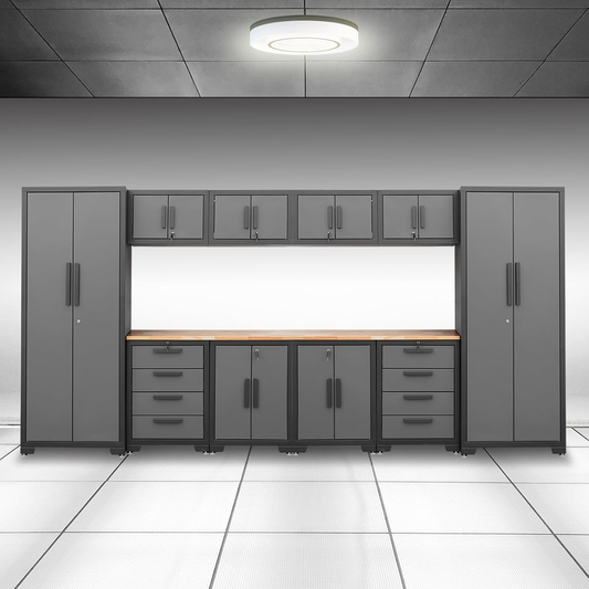 Black and grey garage cabinet system with two tall cabinets, four wall cabinets, four base cabinets, and wood worktops.